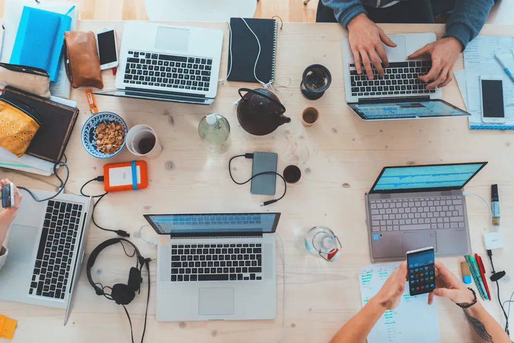 Colleagues planning a digital project around a shared table