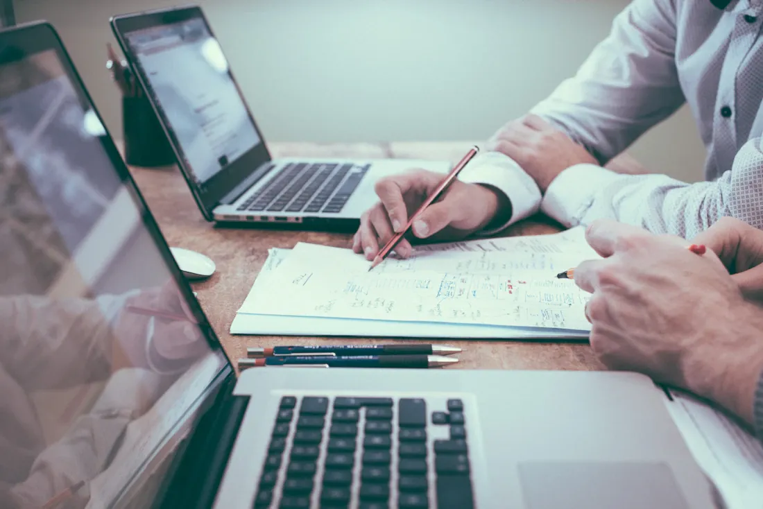 Business professionals reviewing charts and planning documents