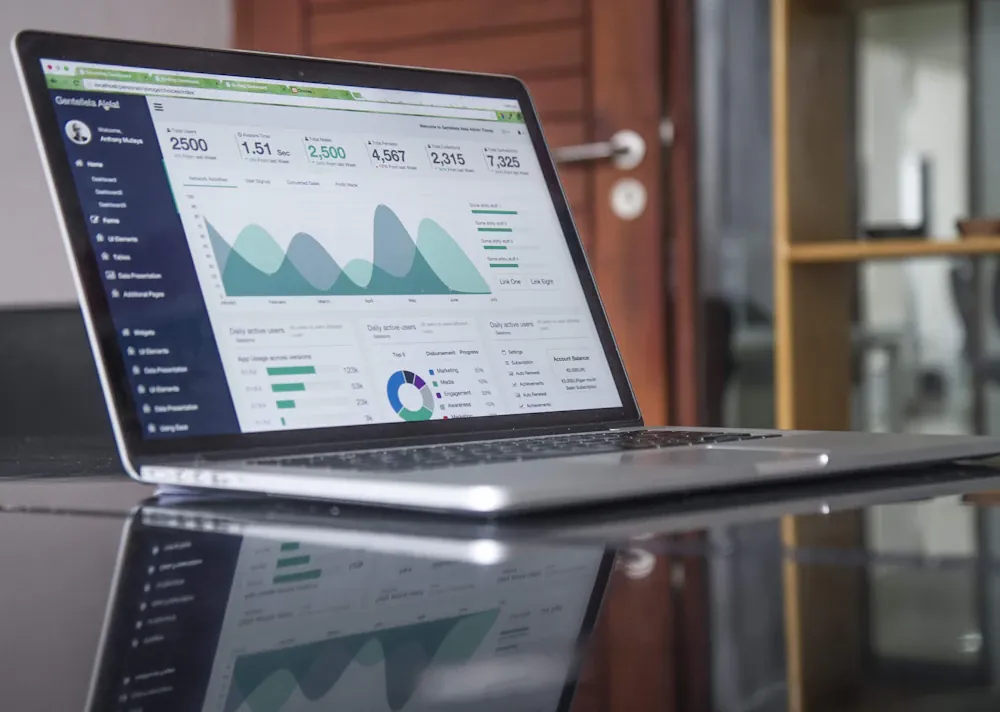 Website analytics and business metrics displayed on a laptop